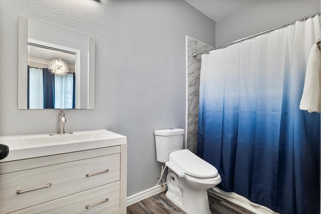 bathroom featuring vanity, hardwood / wood-style floors, curtained shower, and toilet