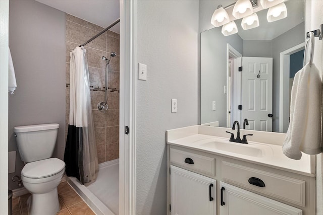 bathroom with vanity, a shower with curtain, tile patterned floors, and toilet