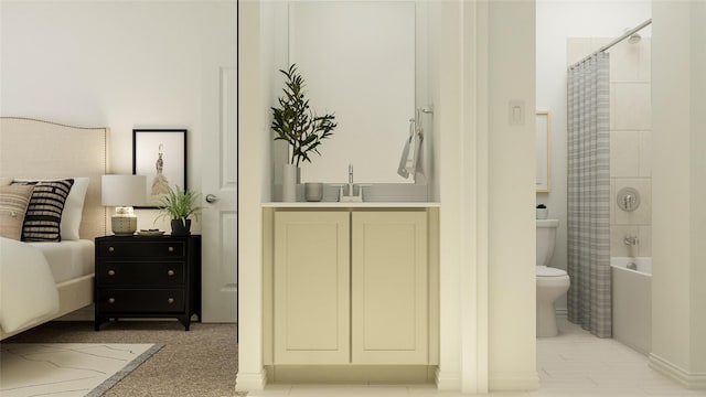 bedroom featuring sink and ensuite bath