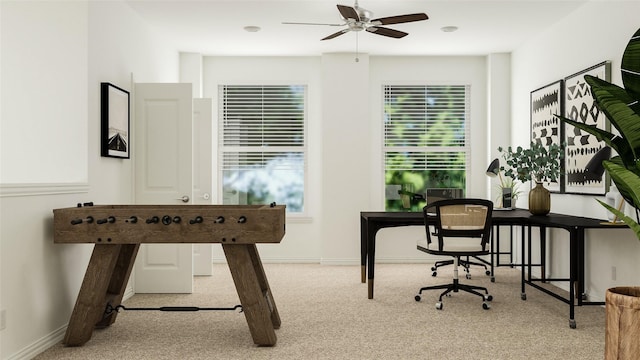 office area with ceiling fan and light colored carpet