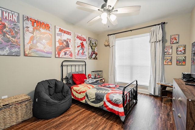 bedroom with ceiling fan and dark hardwood / wood-style floors