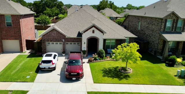 view of front of house with a garage and a front yard