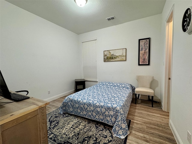 bedroom featuring hardwood / wood-style floors