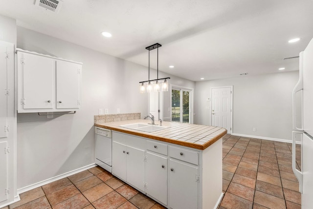 kitchen featuring sink, white cabinets, white dishwasher, and decorative light fixtures