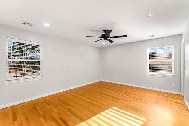 empty room featuring ceiling fan and light wood-type flooring