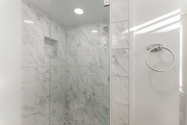 bathroom with tiled shower