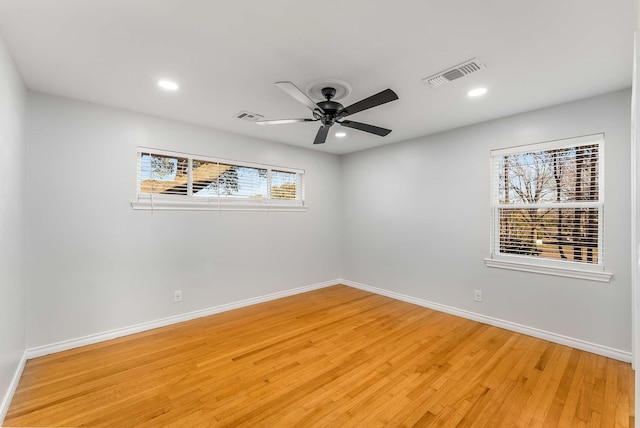 spare room with ceiling fan and light hardwood / wood-style flooring