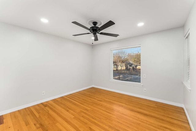 empty room featuring ceiling fan and wood-type flooring