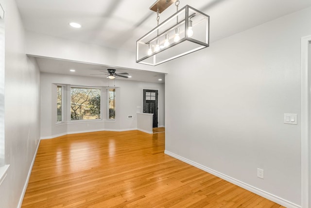 interior space with ceiling fan and light wood-type flooring