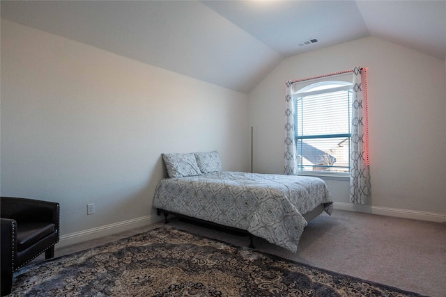 carpeted bedroom with vaulted ceiling, visible vents, and baseboards