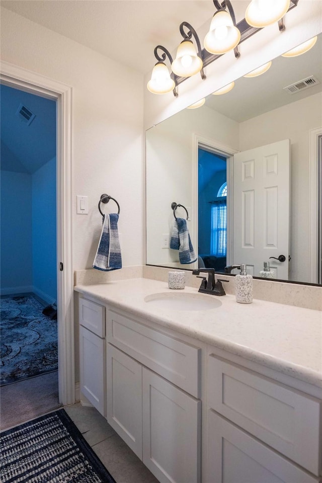 bathroom with a chandelier, tile patterned flooring, visible vents, and vanity