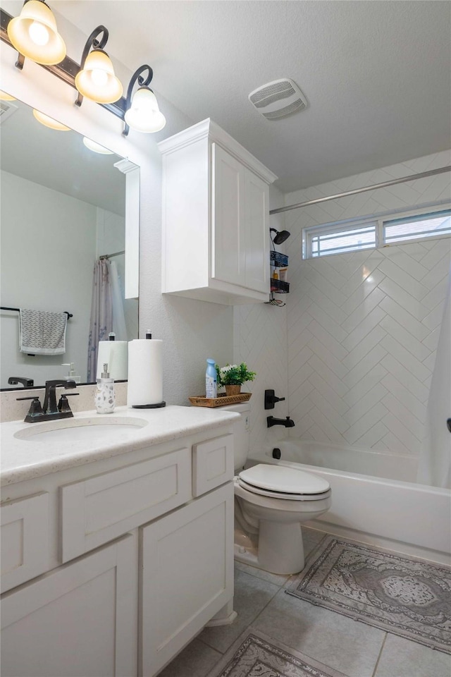 full bathroom featuring visible vents, toilet, tile patterned floors, shower / bath combo with shower curtain, and vanity