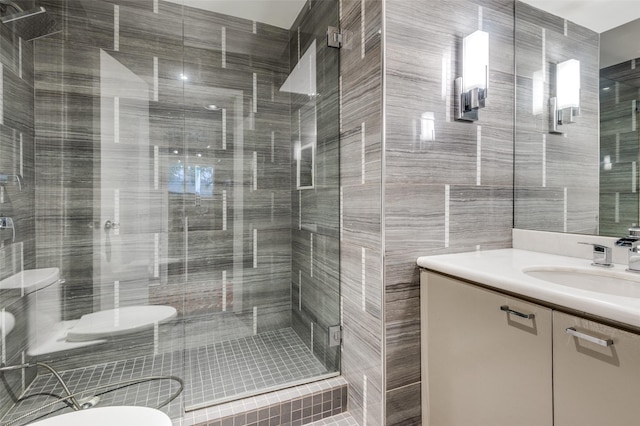 bathroom with vanity, tile walls, and an enclosed shower