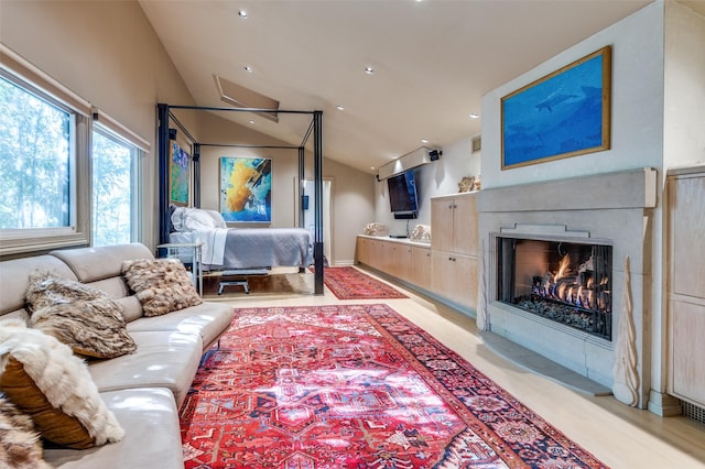 living room featuring vaulted ceiling