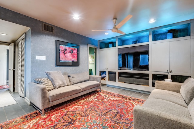 living room with tile patterned floors and ceiling fan