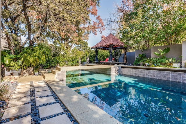 view of swimming pool featuring a gazebo