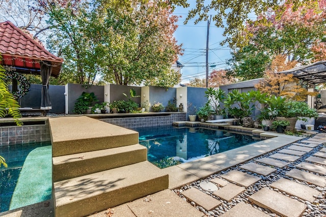 view of swimming pool with a gazebo