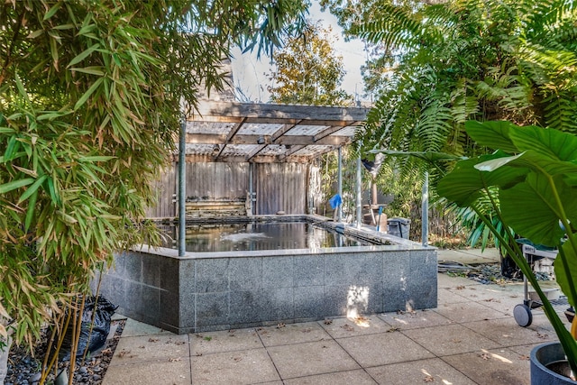 view of patio / terrace featuring a pergola