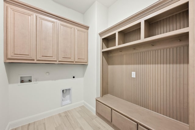 mudroom featuring light wood-style flooring and baseboards