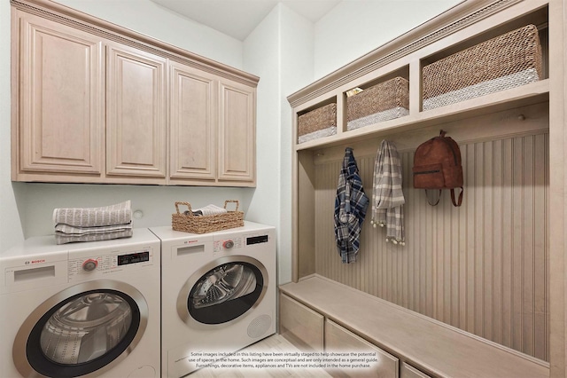 laundry area with cabinet space and washing machine and clothes dryer