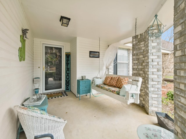 view of patio featuring a porch