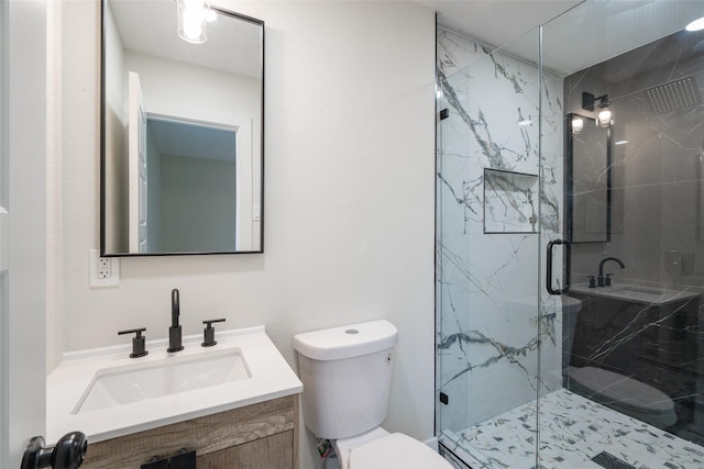 bathroom with vanity, toilet, and walk in shower