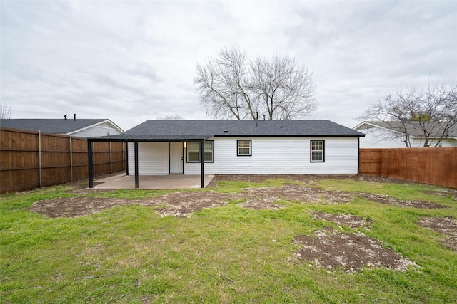 rear view of house featuring a patio and a lawn