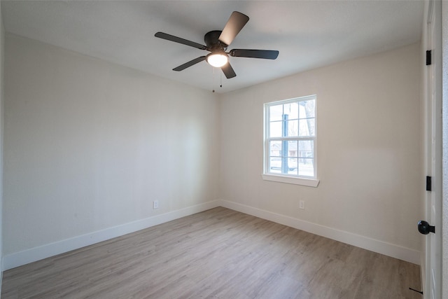 spare room with ceiling fan and light hardwood / wood-style flooring