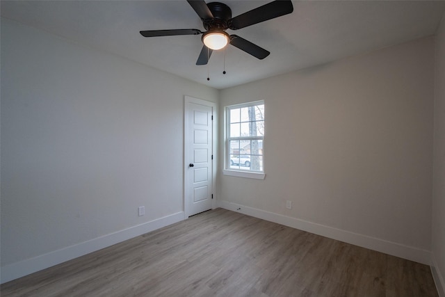 empty room featuring light hardwood / wood-style floors and ceiling fan