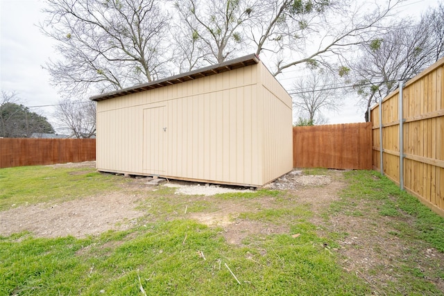 view of outbuilding with a lawn