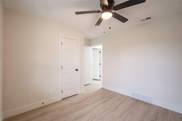 spare room with ceiling fan and light hardwood / wood-style floors