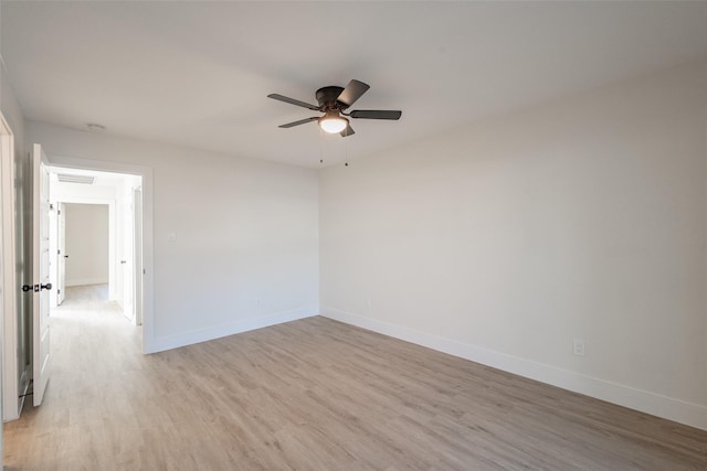 spare room featuring ceiling fan and light hardwood / wood-style floors