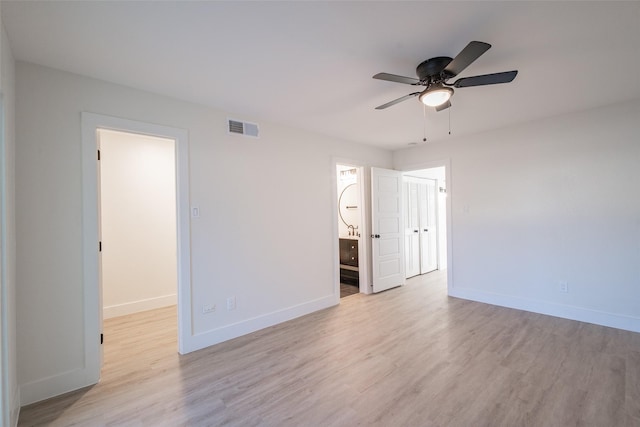 empty room featuring light hardwood / wood-style flooring and ceiling fan