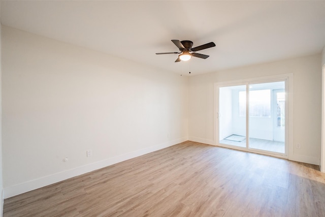 spare room featuring ceiling fan and light wood-type flooring