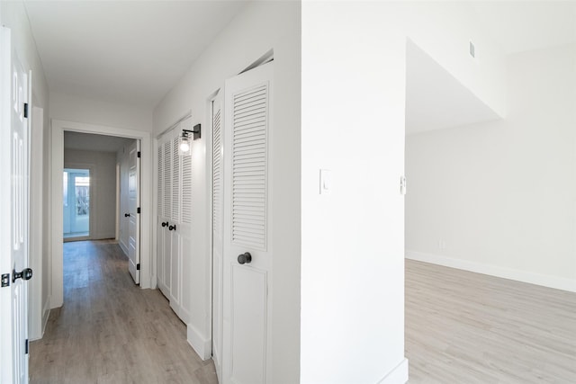 hallway featuring light hardwood / wood-style floors