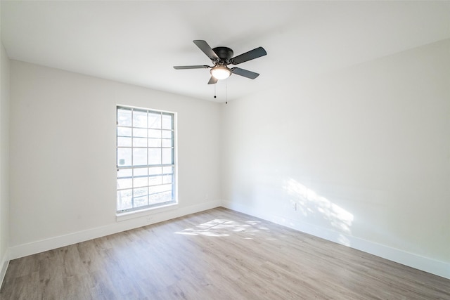 spare room with ceiling fan and light hardwood / wood-style flooring