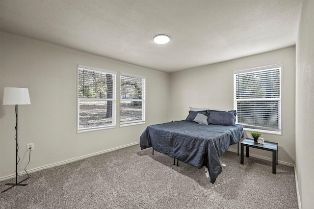 carpeted bedroom with a textured ceiling