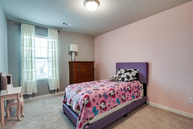 bedroom with light colored carpet