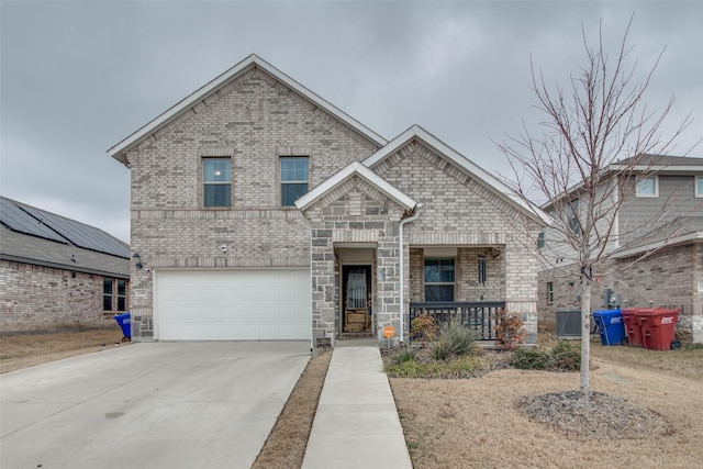 view of front of property with a garage and covered porch