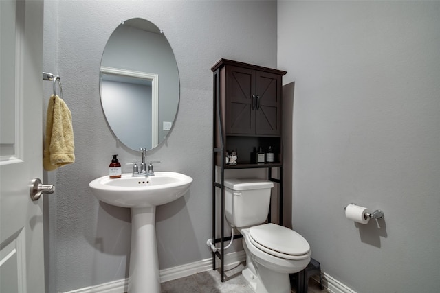 bathroom featuring toilet