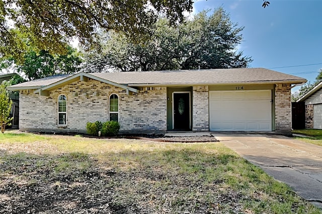 ranch-style home featuring a garage