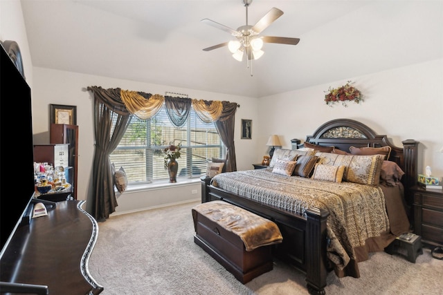 bedroom featuring ceiling fan, baseboards, carpet, and vaulted ceiling