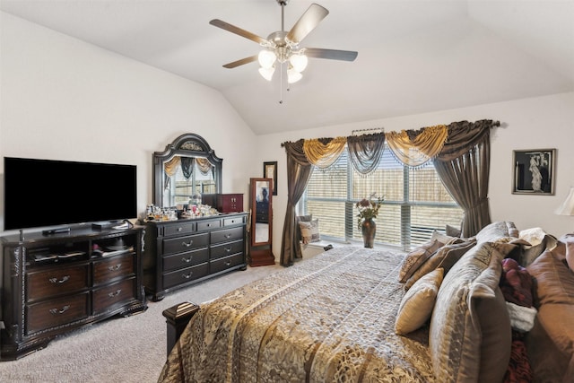 bedroom featuring light colored carpet, a ceiling fan, and vaulted ceiling