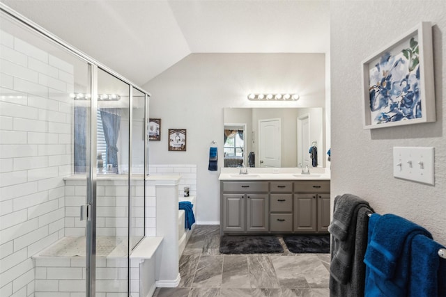 bathroom featuring vaulted ceiling, a garden tub, double vanity, and a stall shower