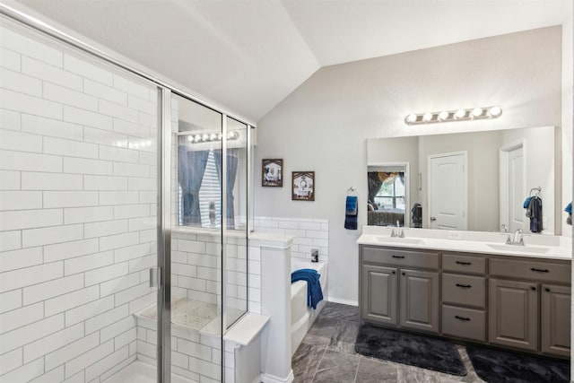 bathroom with a shower stall, a garden tub, double vanity, vaulted ceiling, and a sink