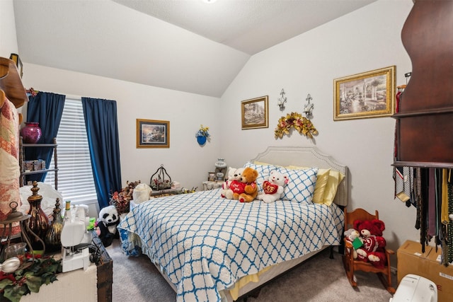 bedroom featuring vaulted ceiling and carpet floors