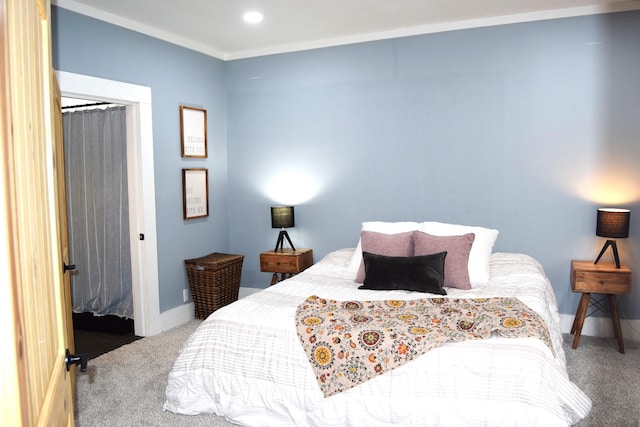 bedroom featuring crown molding, carpet floors, and a closet