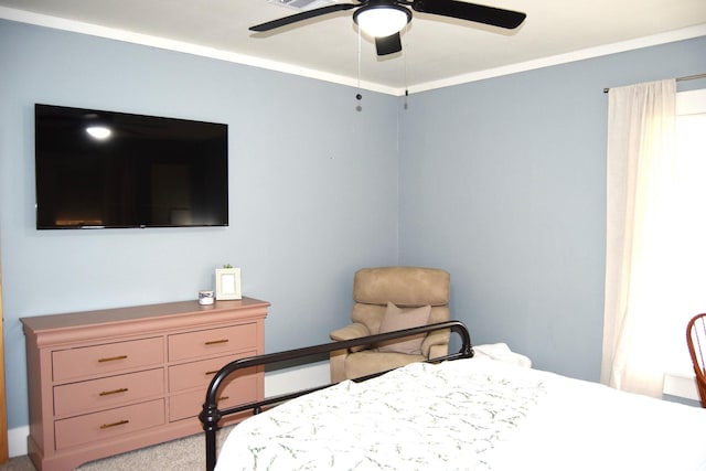 bedroom with ornamental molding, light carpet, and ceiling fan