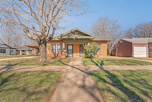 view of front of house with a front lawn and a carport