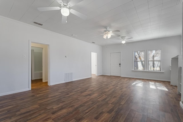 unfurnished living room featuring crown molding, dark wood-type flooring, and ceiling fan